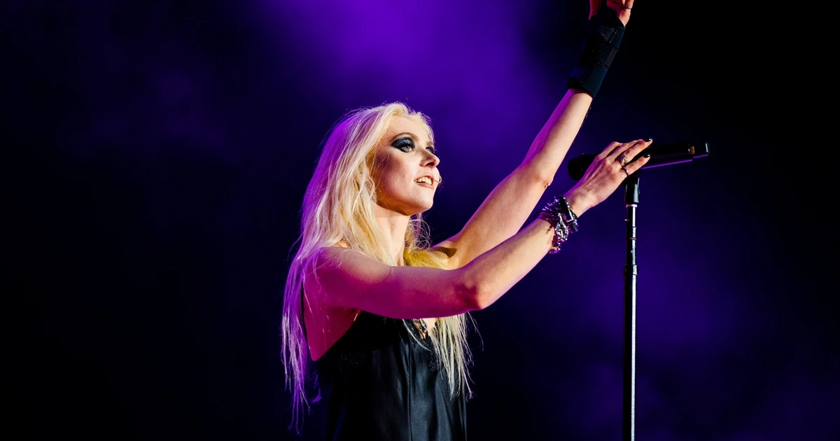 THE PRETTY RECKLESS' TAYLOR MOMSEN bit by spider ahead of show with AC/DC